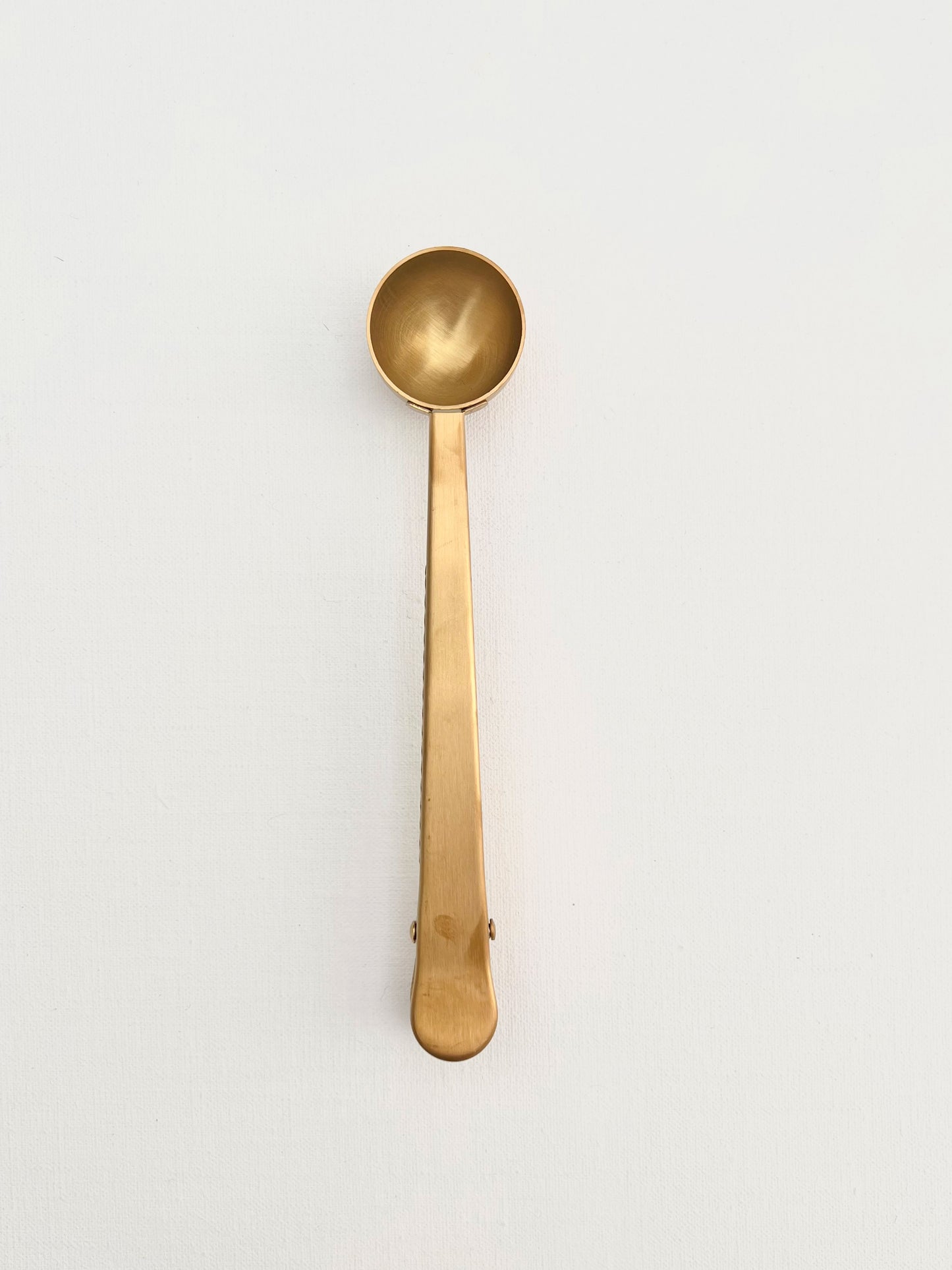 Brass coffee scoop clip